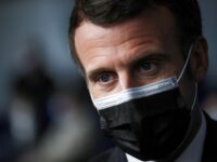 French President Emmanuel Macron visits a COVID-19 vaccination center in Valenciennes, France March 23, 2021. Yoan Valat/Pool via REUTERS